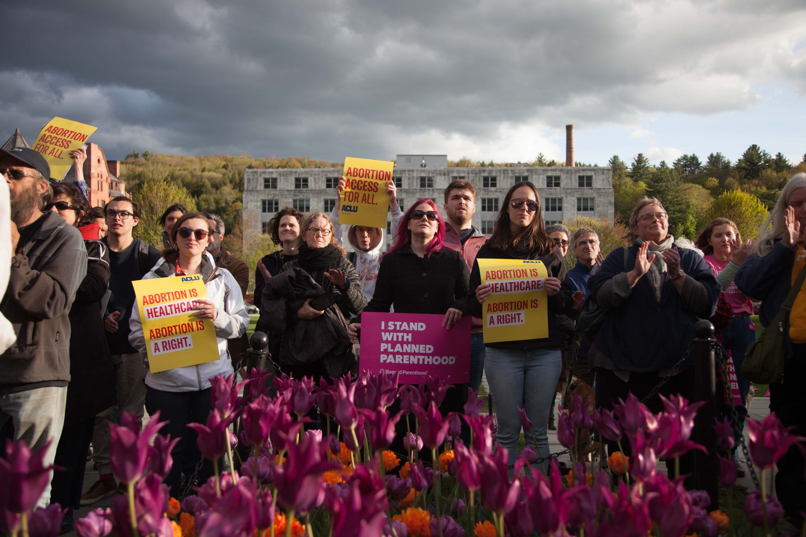 Protesters and flowers