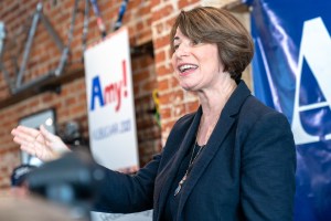 Amy Klobucher smiles and gestures