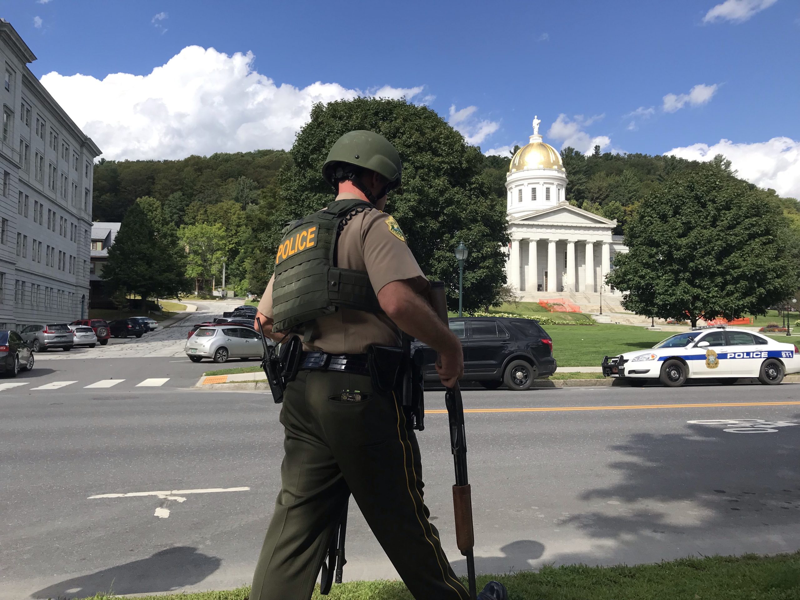 trooper carrying long guns