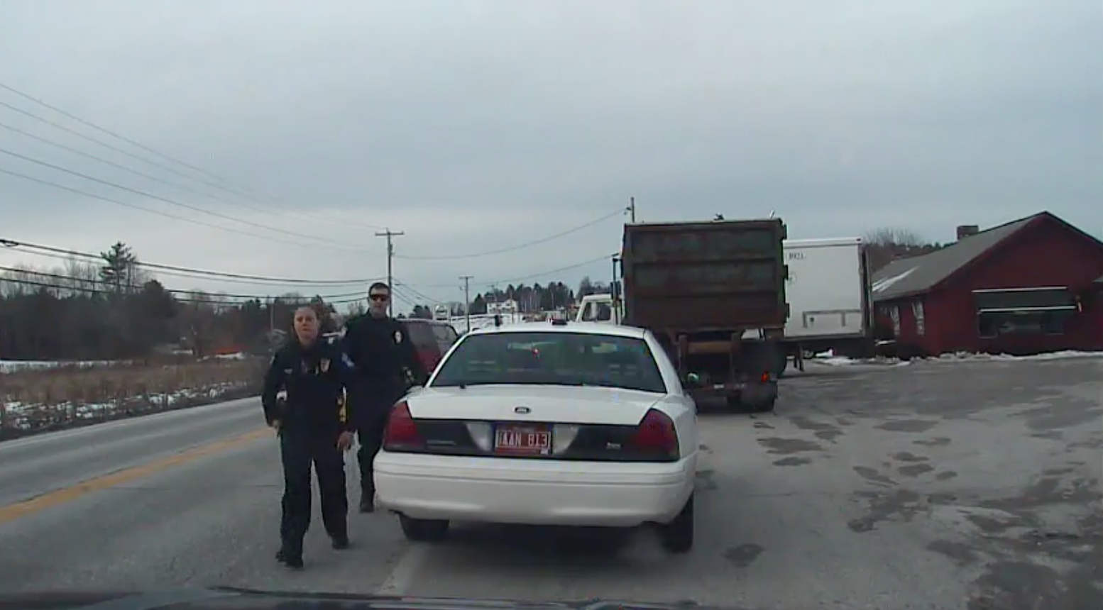 Dashcam footage from Officer Misty Klementowski’s cruiser shows Officer Ryan Ashe returning to his cruiser after the altercation with Kevin Elnicki.
