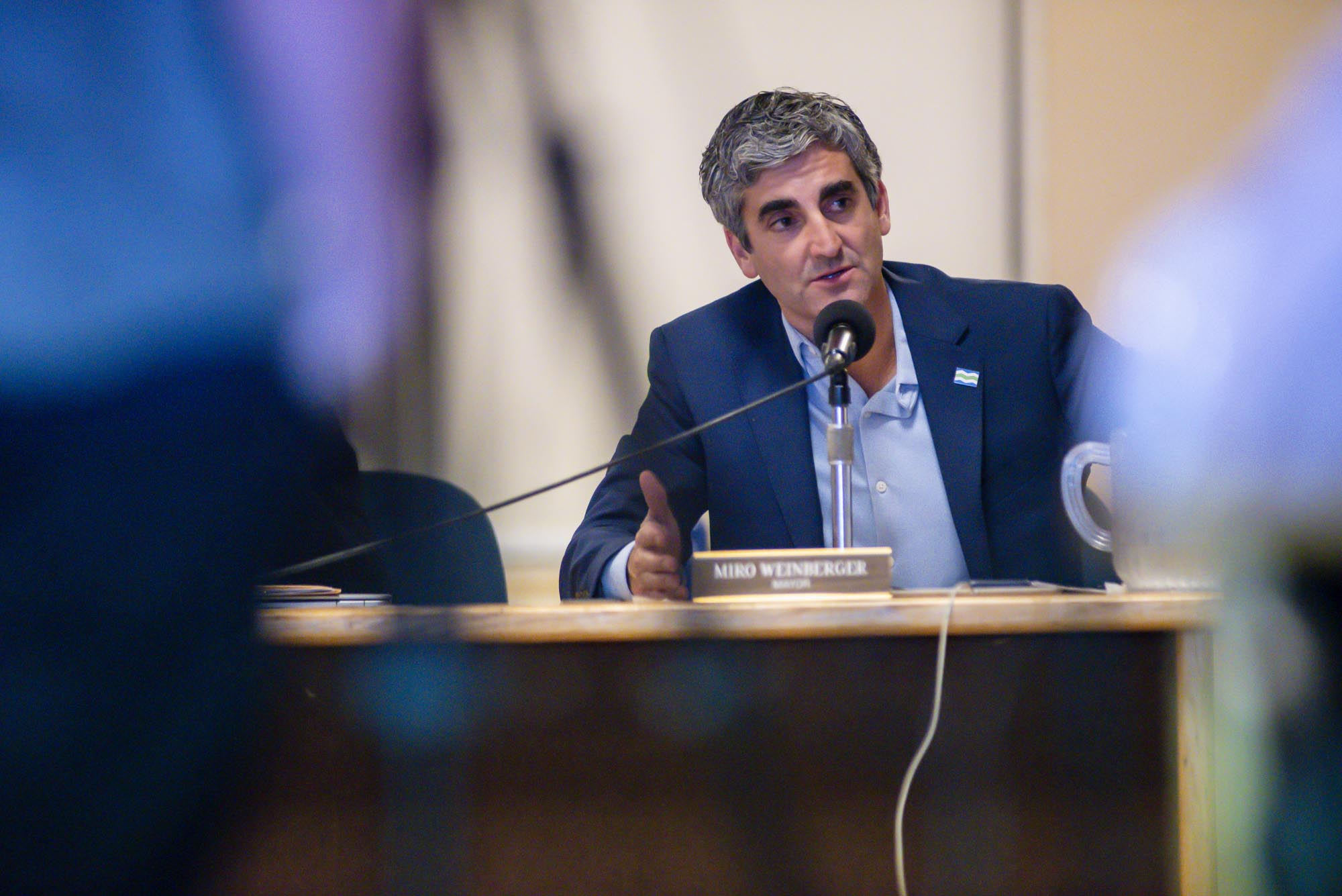 Miro Weinberger speaking into a microphone