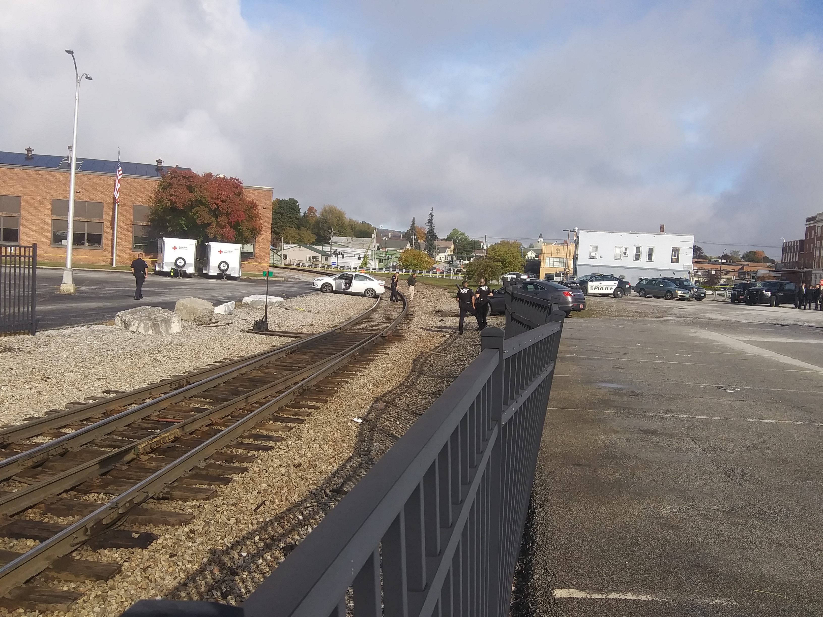 A car involved in an officer-involved shooting Tuesday morning blocks the train tracks in Rutland, temporarily suspending the Amtrak service. Photo by Alan Keays/VTDigger