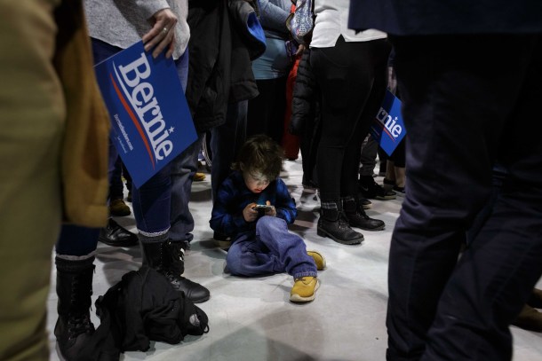 child on ground at bernie rally