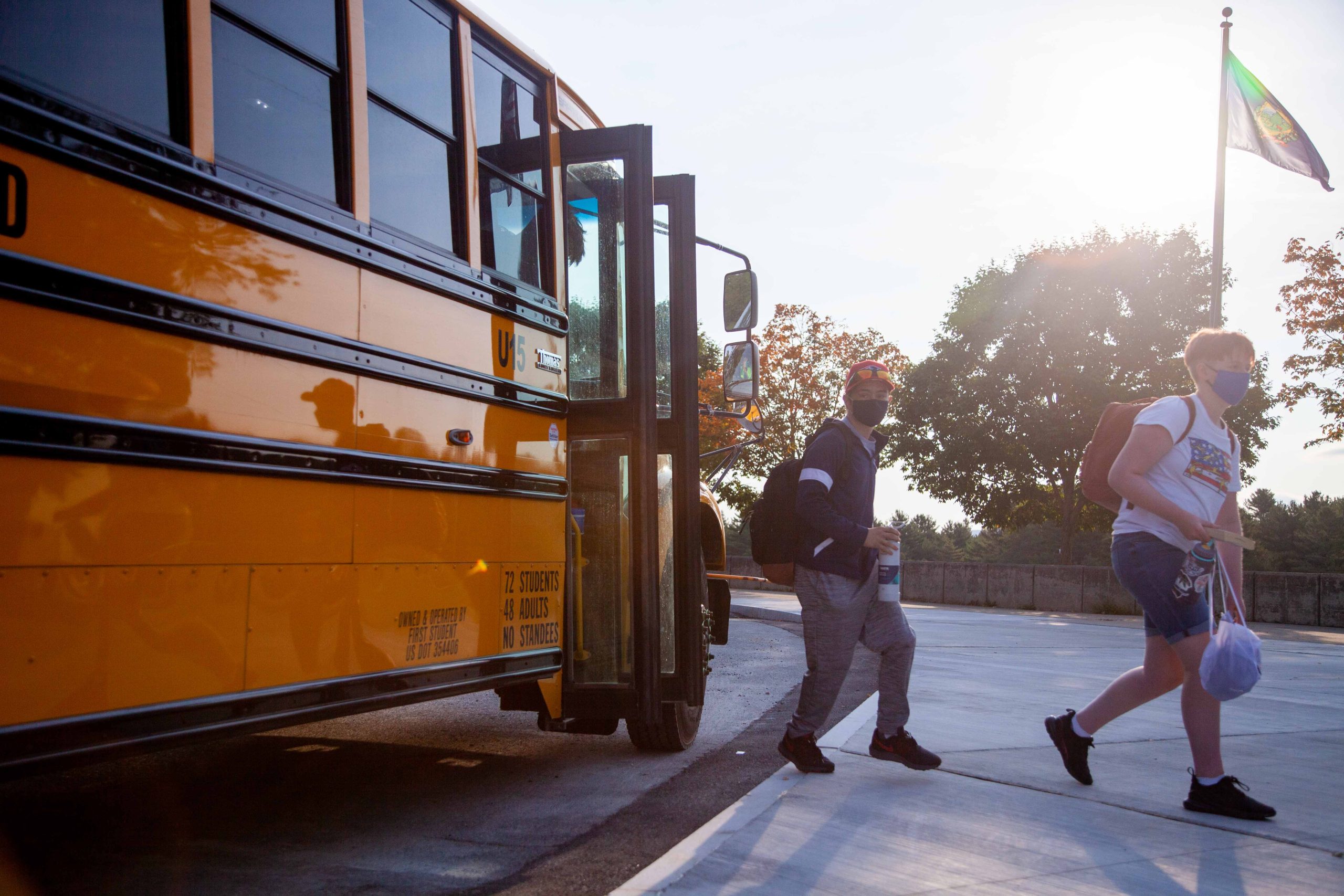 Students exit school bus