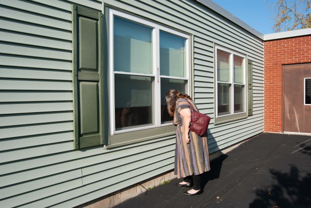Rebecca Whittemore-Arsenault peers into window