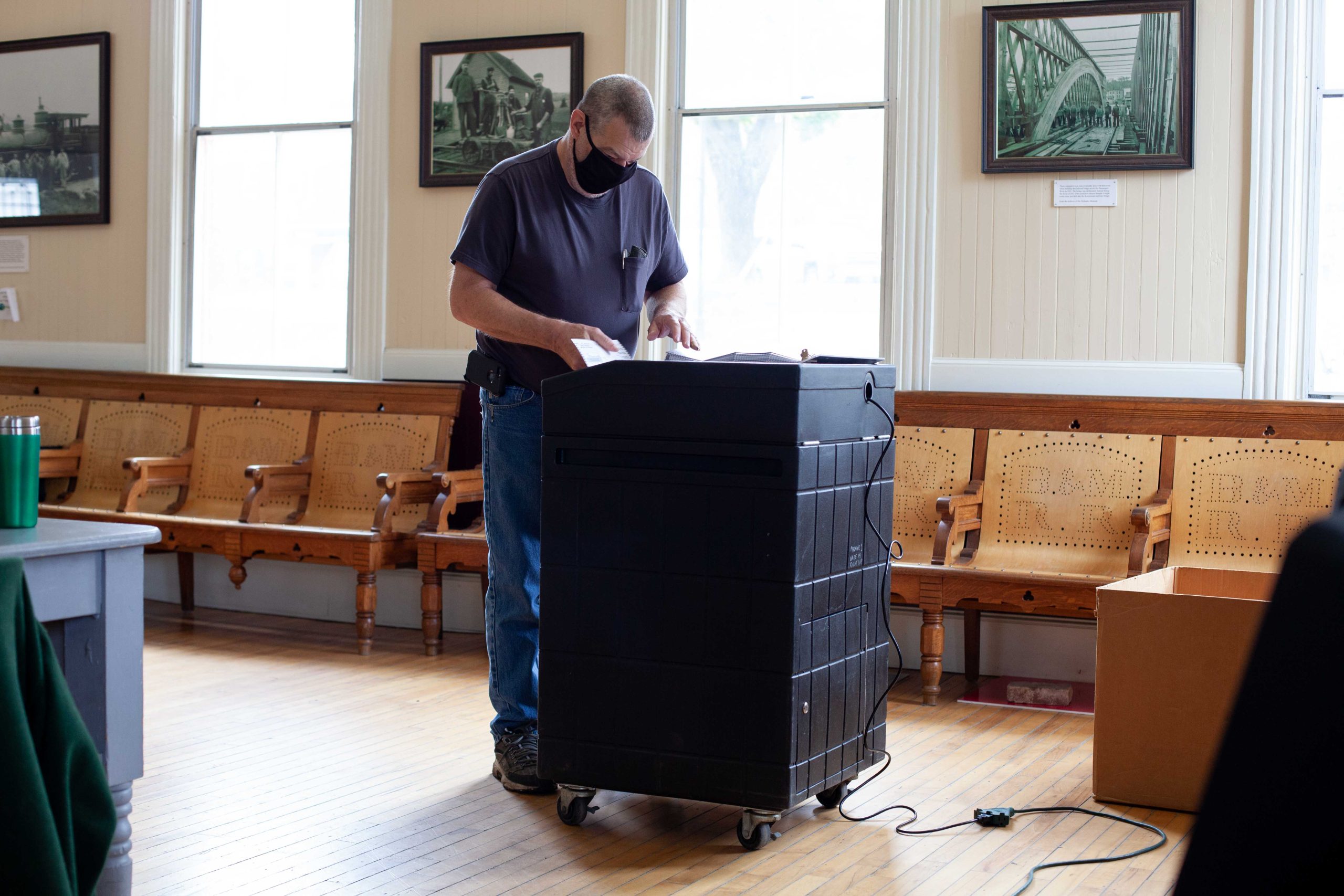 Kevin Oddy stands at tabulating machine