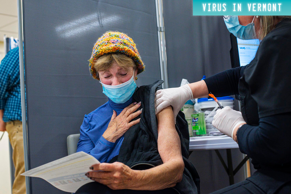 masked woman receiving vaccine