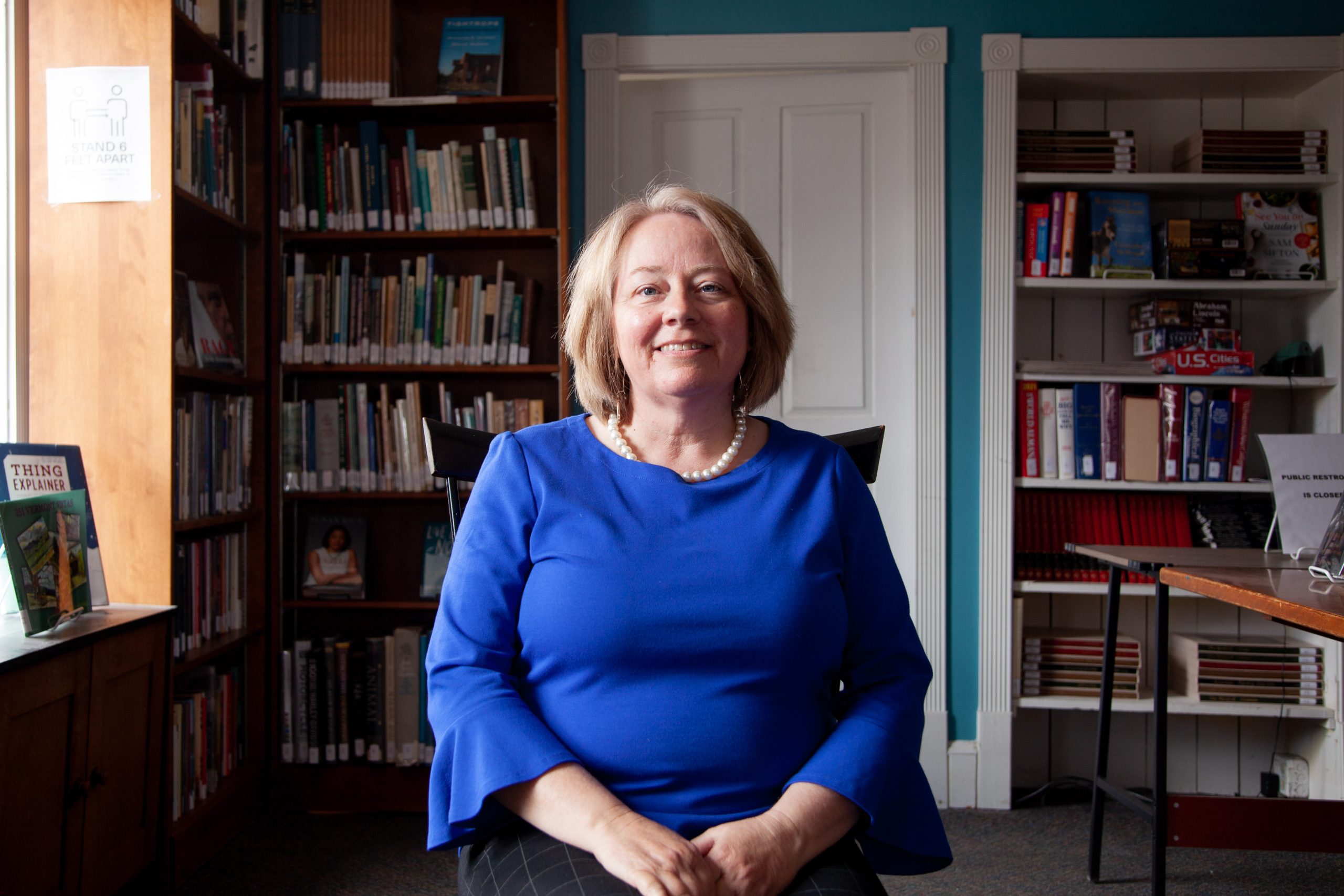 Woman in chair inside library