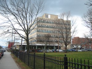 A large building in the middle of a city.