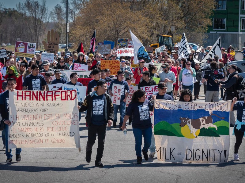 A group of people holding signs.
