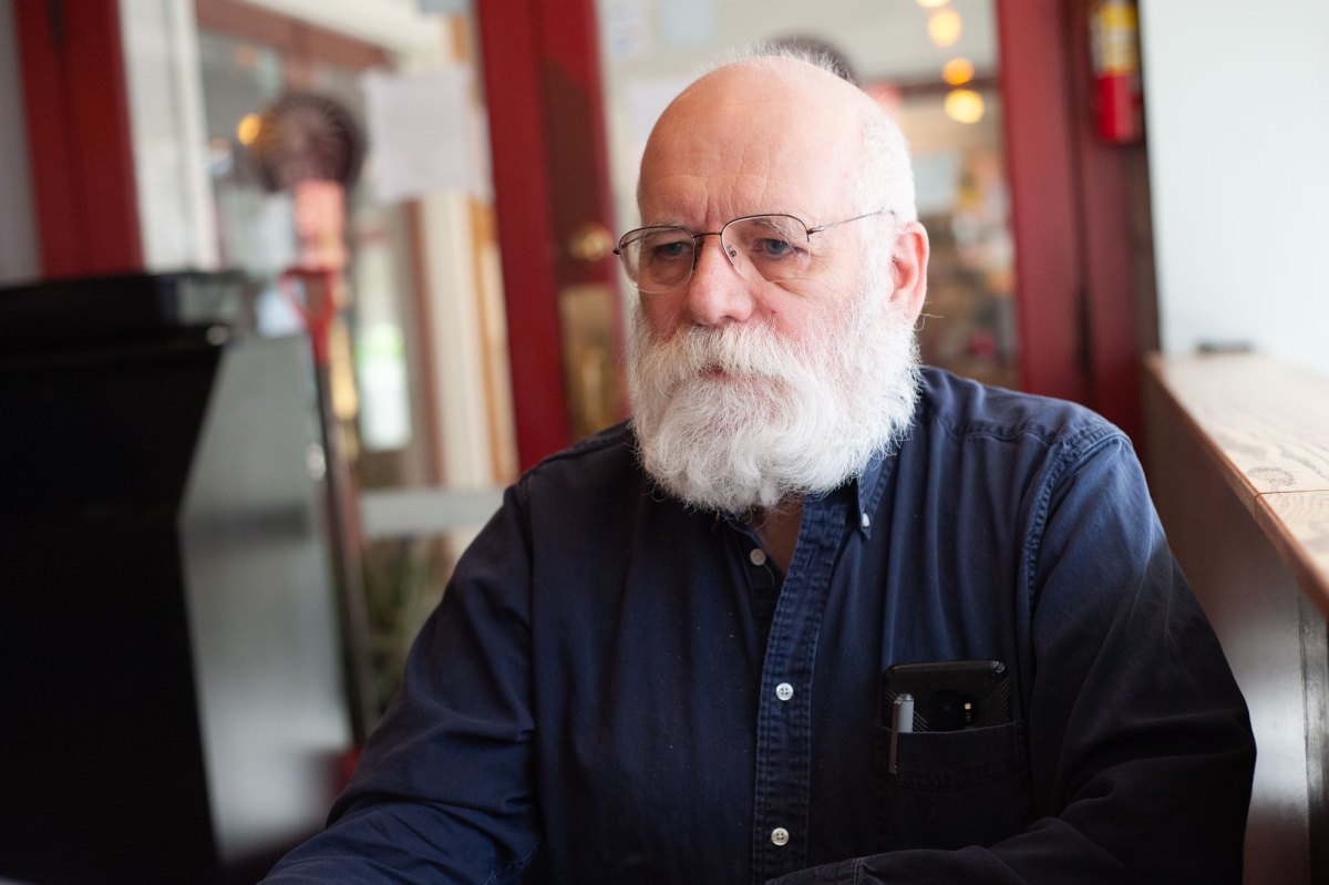 A man in a navy button down.