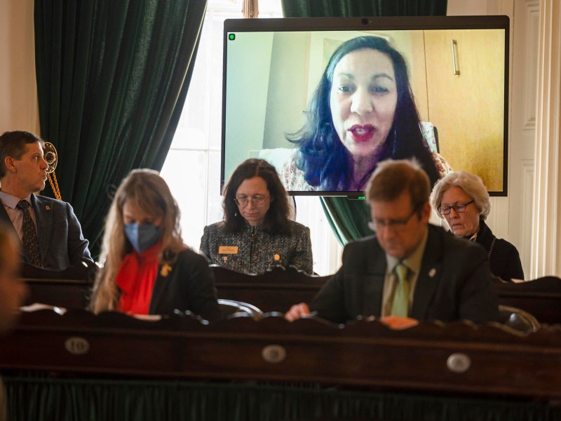 a group of people sitting in front of a tv.