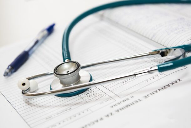 A stethoscope on a patient chart.