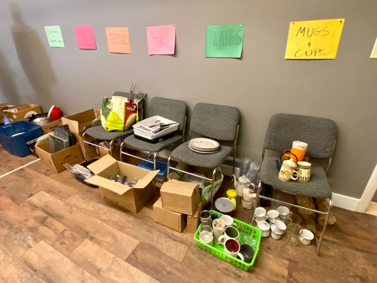 A room full of boxes and a sign on the wall.