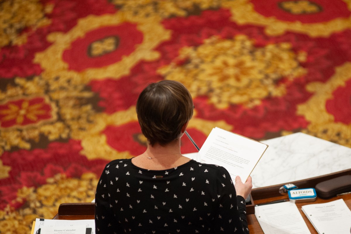 A woman reads a document.