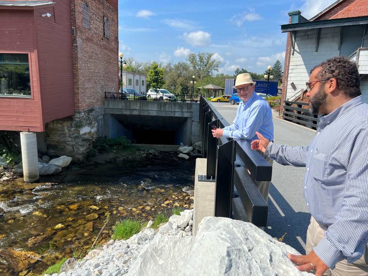 two men in brandon near box culvert