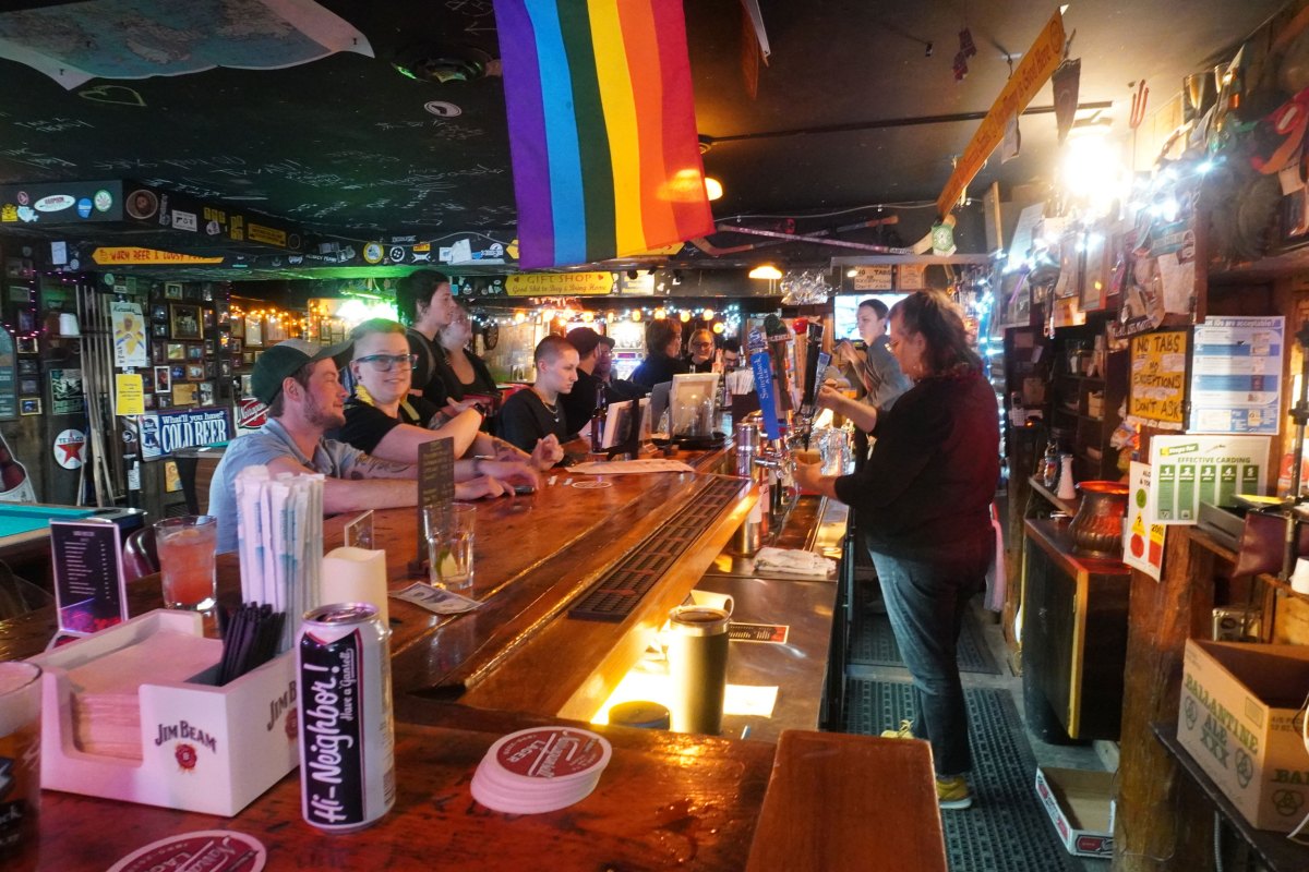 People gather at a bar.