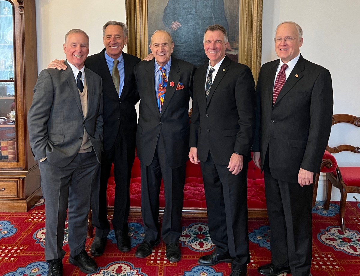 Five me in suits pose