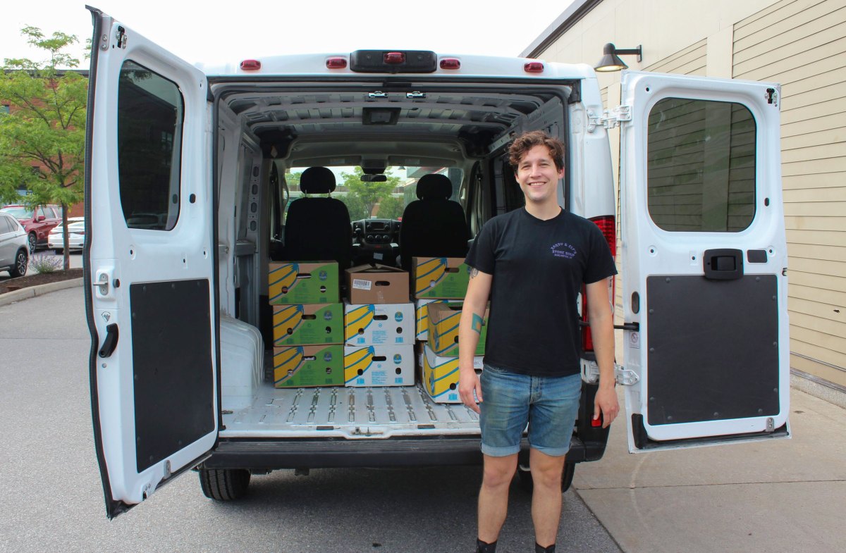 a man standing in front of a van.