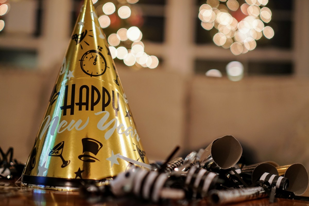 A golden hat that reads "Happy New Year."