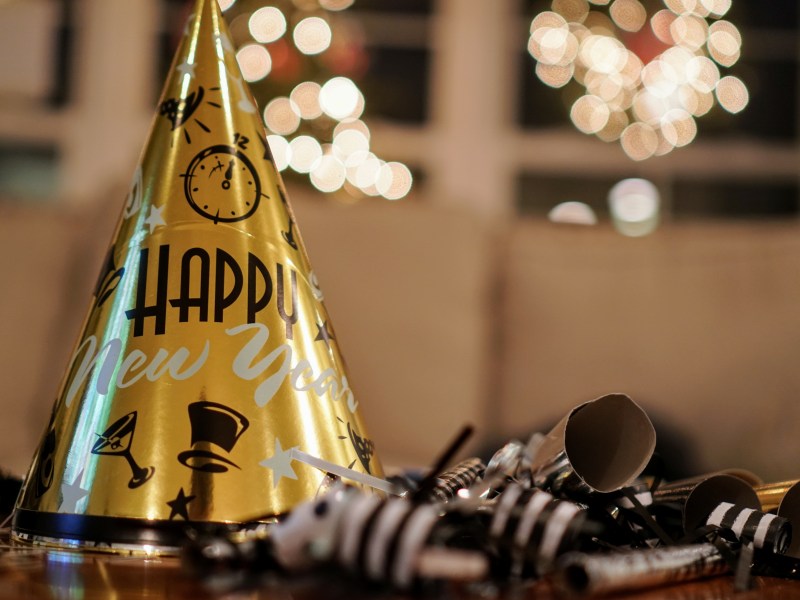 A golden hat that reads "Happy New Year."