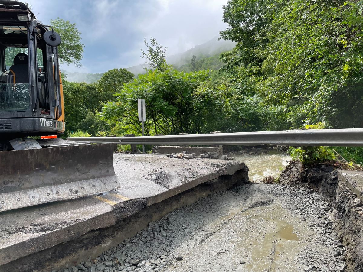 A bulldozer is working on a road.