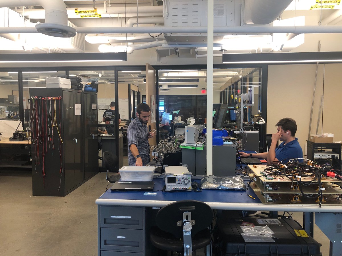 A group of people working in a lab.