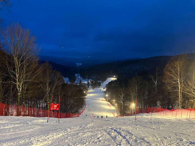 The ski slope is covered in snow.
