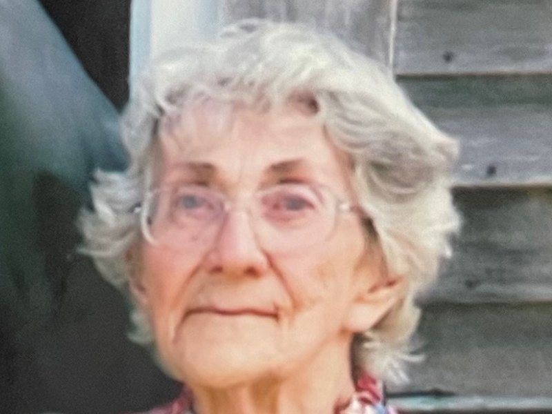 An older woman wearing glasses.