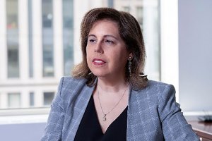 A woman in a blazer.