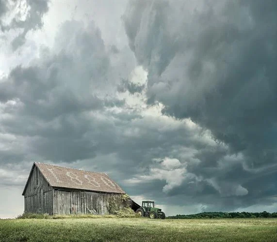 Barn under cloudy sky