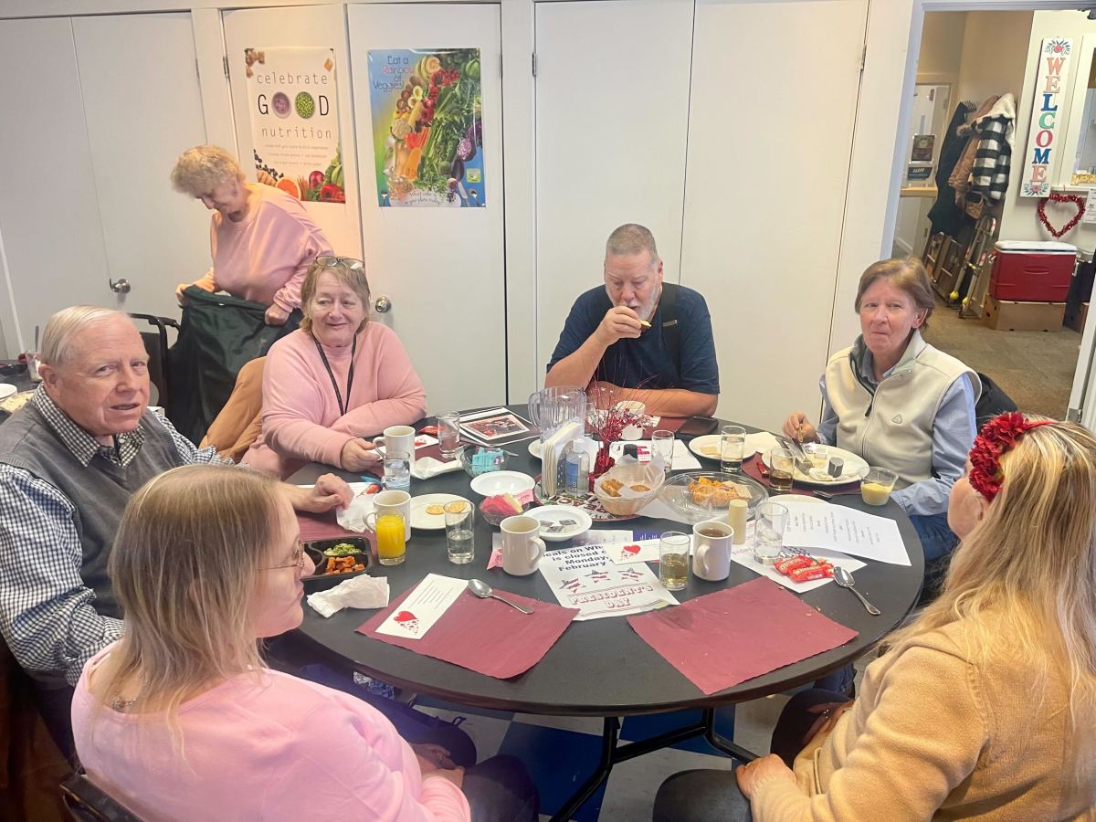 A group of people around a table.