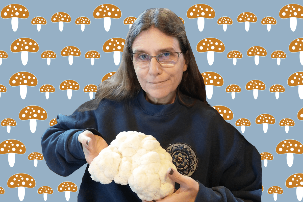 A photo of a woman holding a large white mushroom against a blue and brown mushroom background.