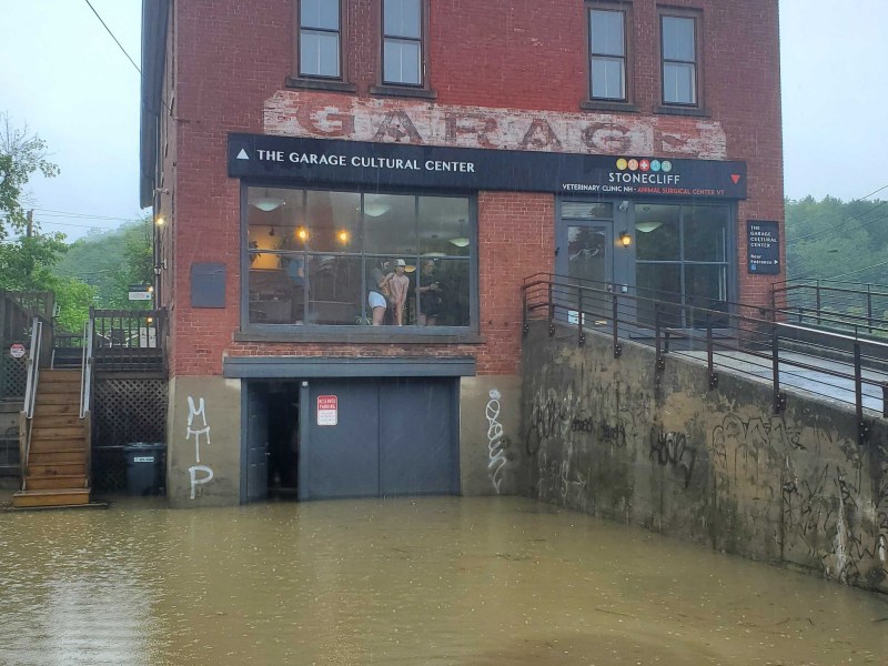 a building is flooded with water in front of it.