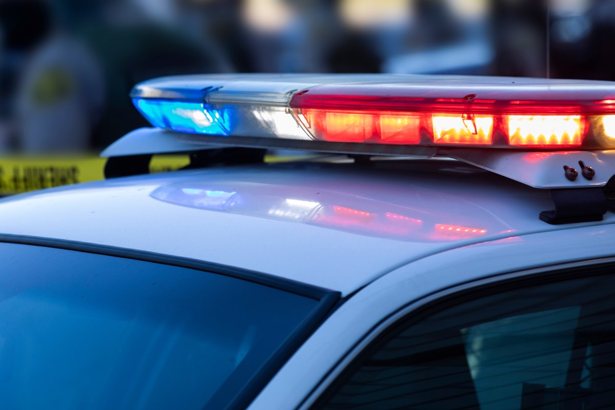 Red and blue lights on top of a police car.