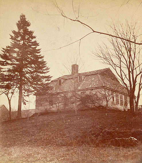A house in the middle of a field.