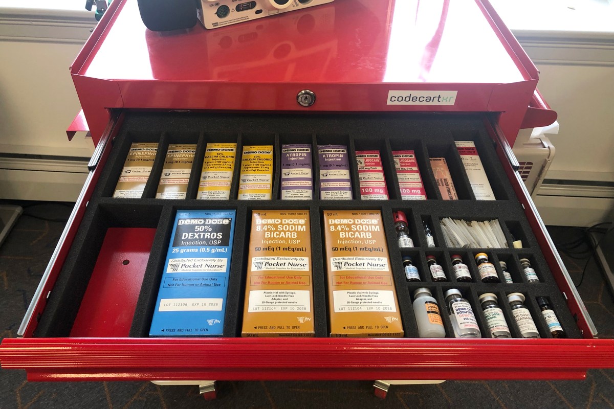 A red drawer filled with a variety of products.