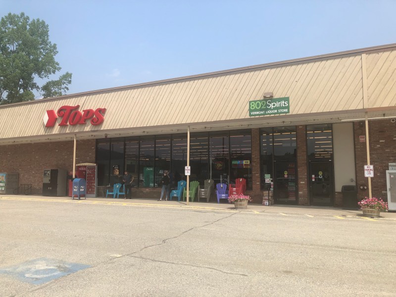 the front of a store with a sign on it.