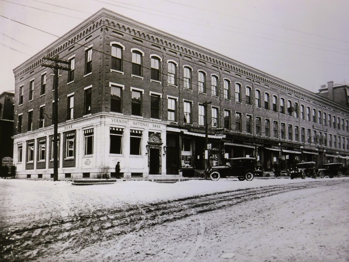 An old photo of a building in the snow.