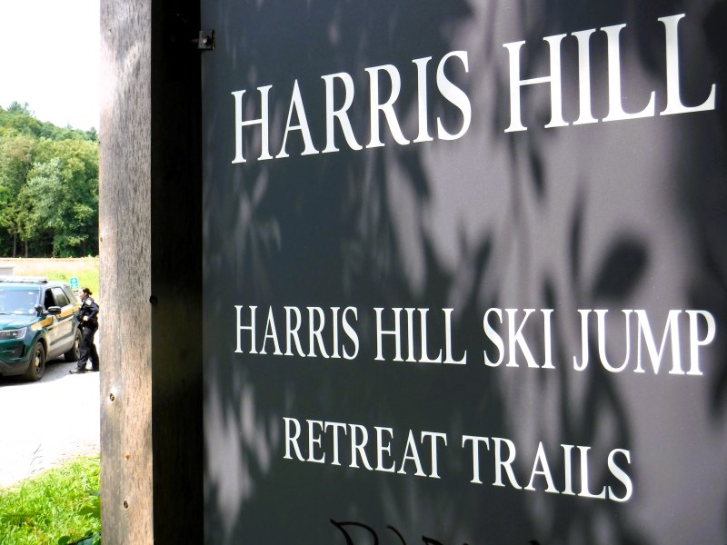 police officer outside care at ski jump