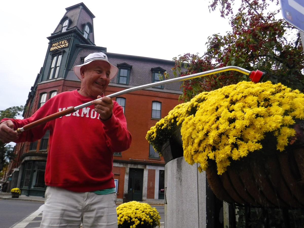 The man is wearing a red sweater.