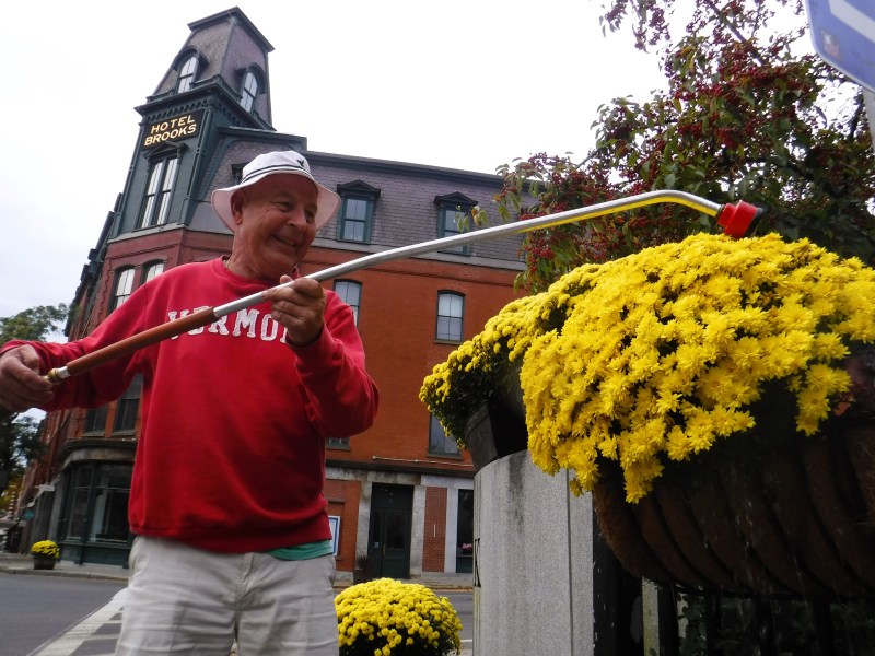 The man is wearing a red sweater.