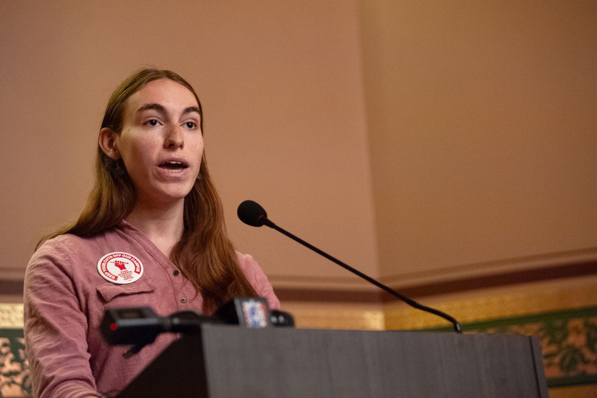 A student speaks into a microphone.