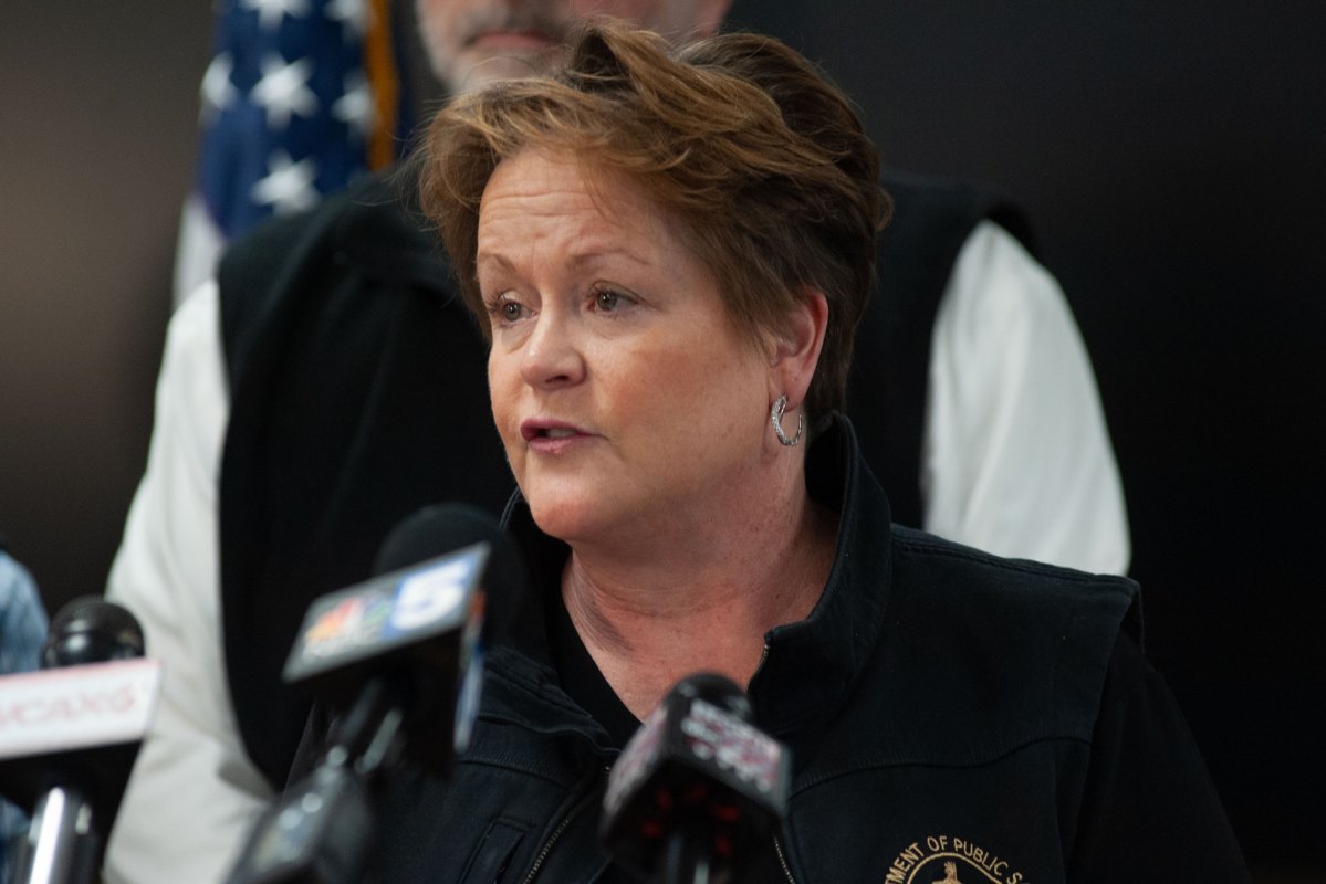 A woman speaks at a podium.