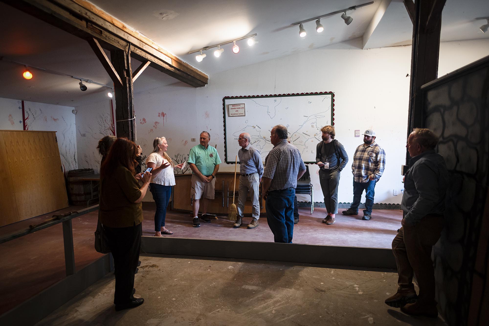 A group of people standing in a room.