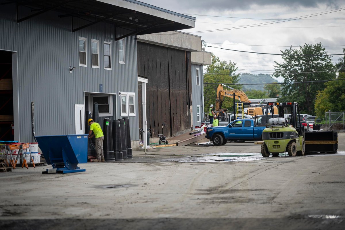 A truck is parked in front of a building.