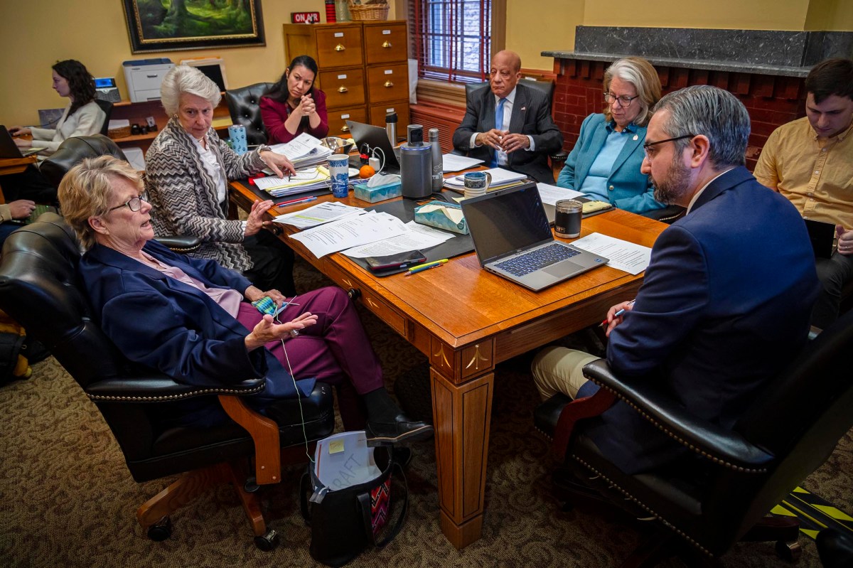 A group of people sitting around a table.