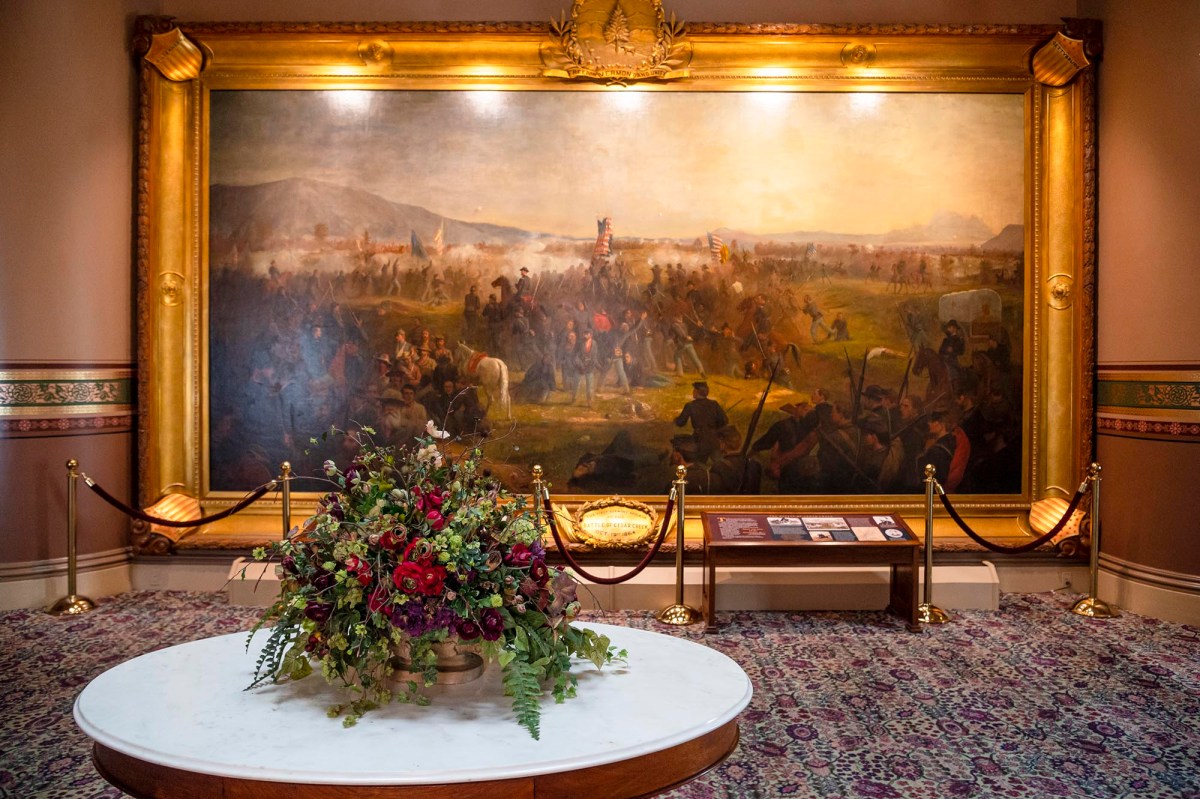 a painting on a wall in a room.