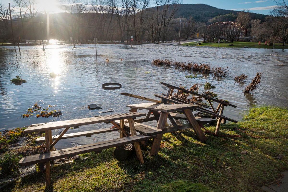 A picnic table in a flooded area.
