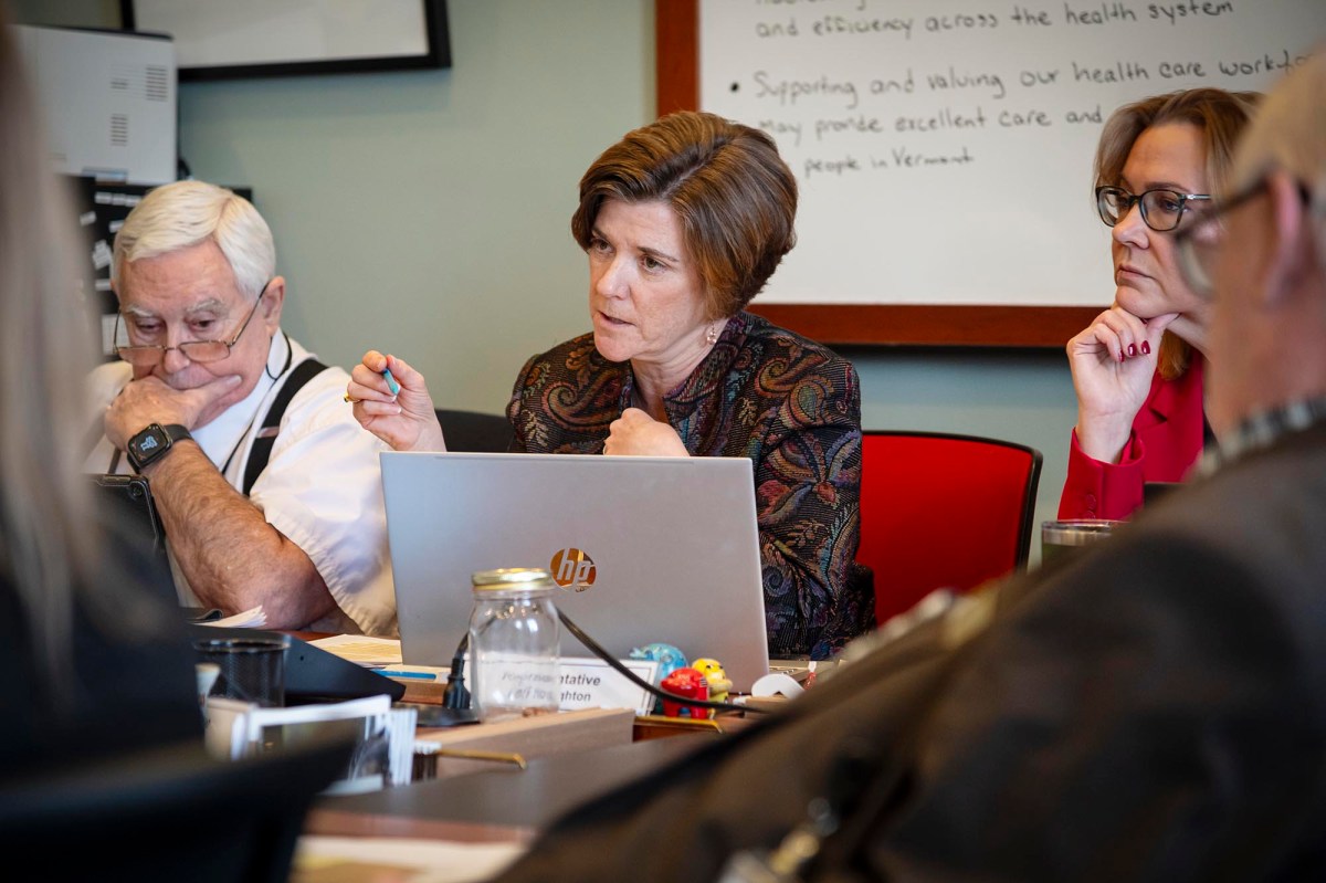 A group of people sitting around a table.
